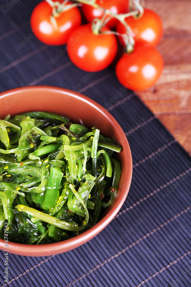 Seaweed salad in bowl with cherry tomatoes Seaweed salad in bowl with cherry tomatoes