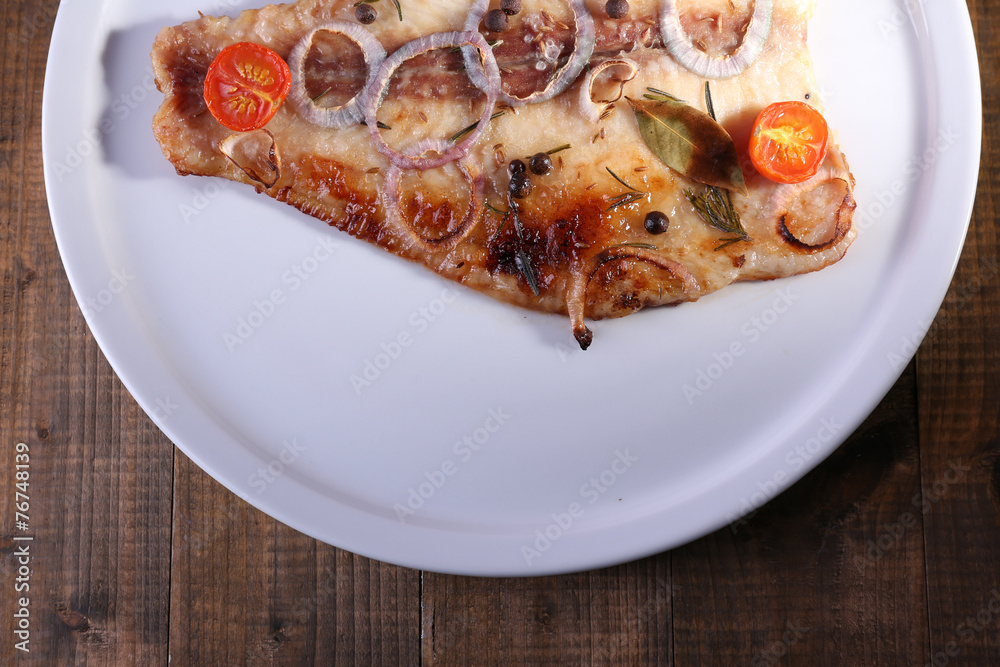 Dish of Pangasius fillet with spices and vegetables Dish of Pangasius fillet with spices and vegetables