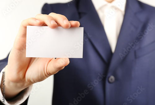 Businessman with business card, close-up