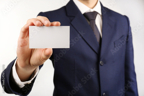 Businessman with business card, close-up