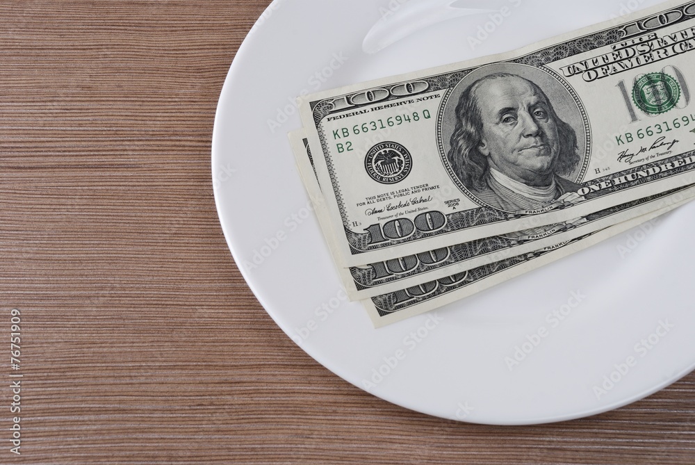 Dollar bank note money in the white plate