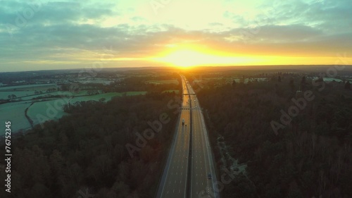 Aerial view of a truck and other traffic driving along a road  
