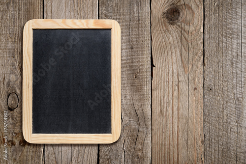 Empty blackboard on old wooden background