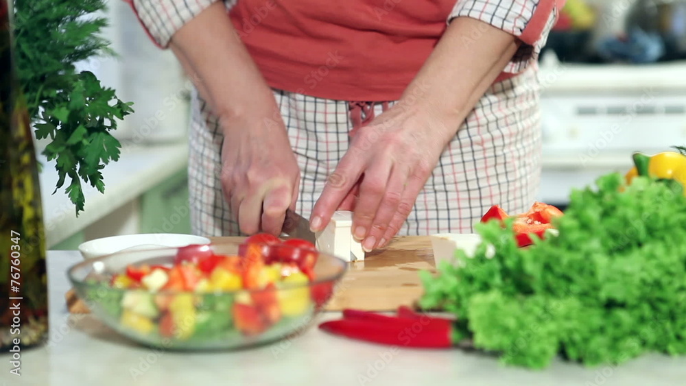 Female hands slicing red tomato, dolly shot Female hands slicing red tomato, dolly shot