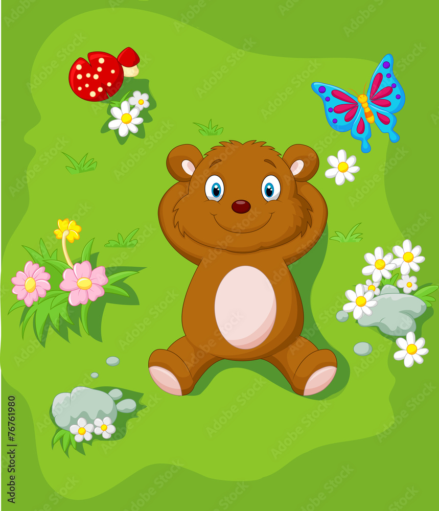 Happy bear lying down on the grass Happy bear lying down on the grass