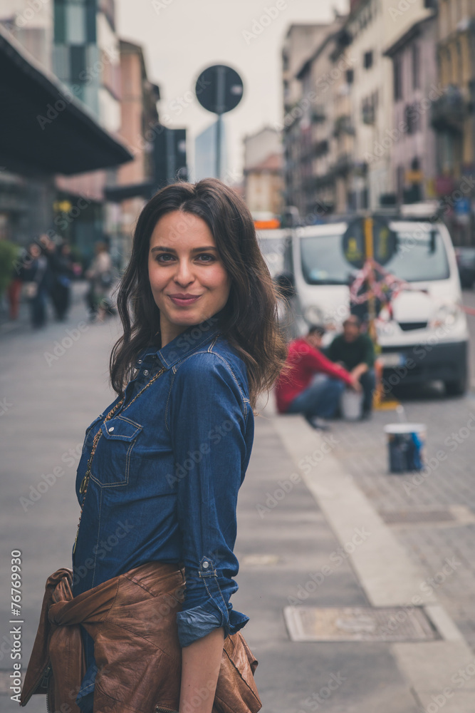 Pretty girl posing in the city streets