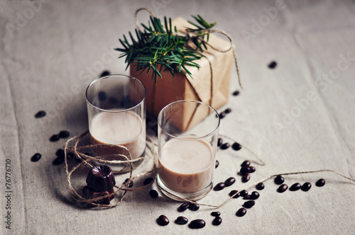 Baileys Irish cream in shot glasses with dark chocolate sweets,