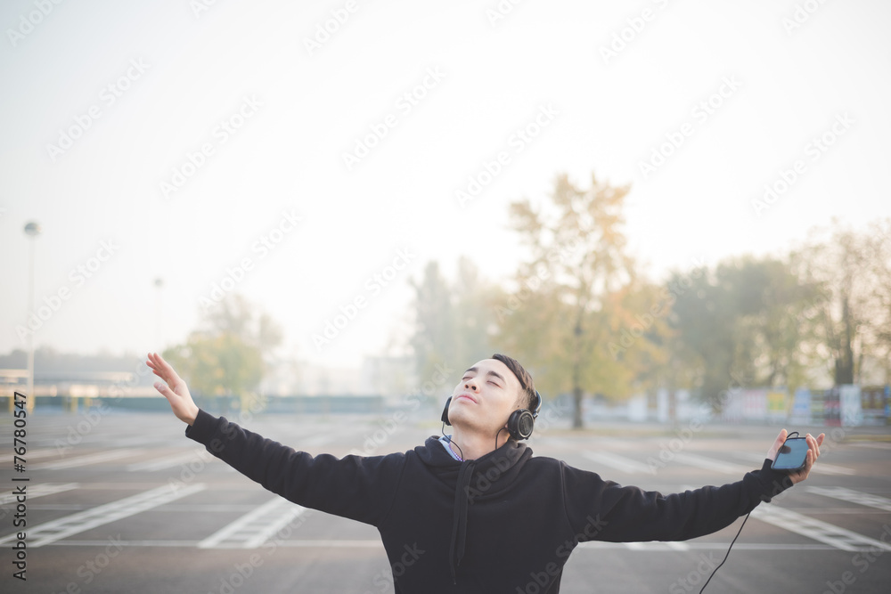 young crazy funny asian man in town outdoor lifestyle listening young crazy funny asian man in town outdoor lifestyle listening