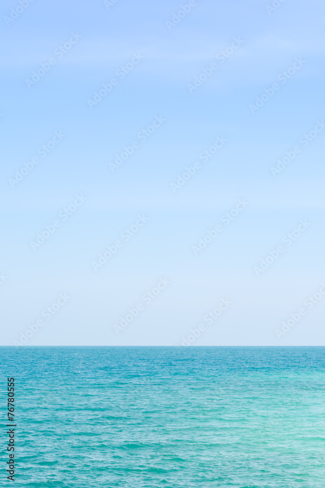 Calm sea in blue sky.