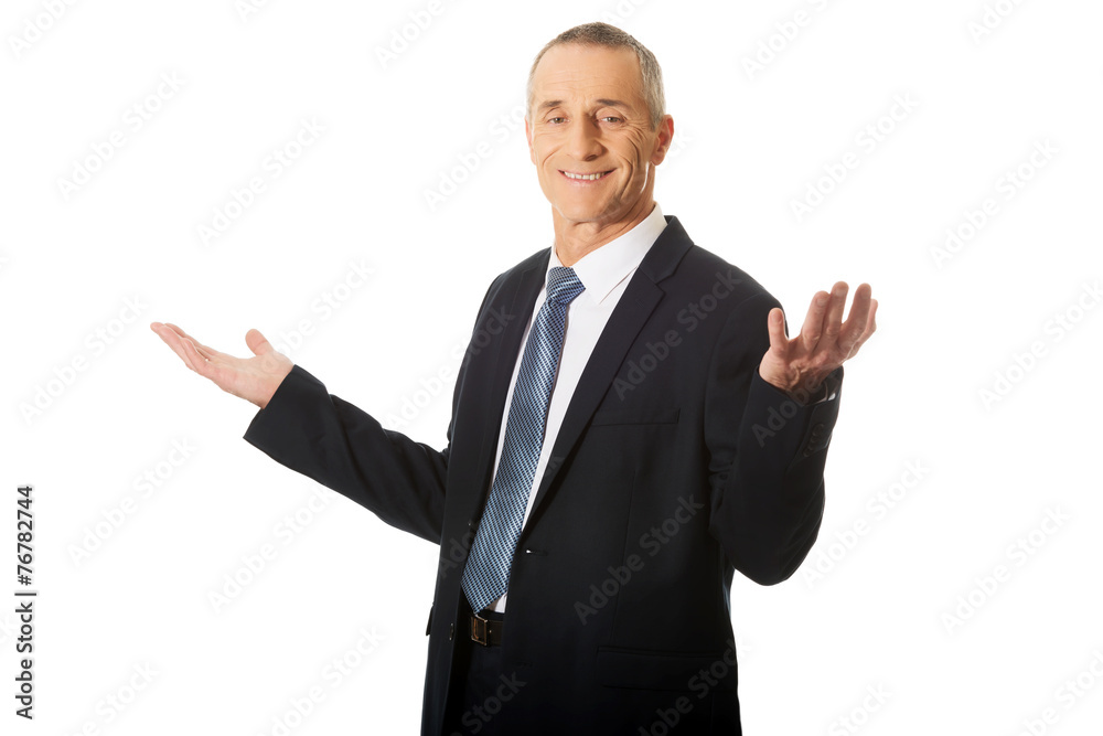Businessman with open hands in undecided gesture Businessman with open hands in undecided gesture