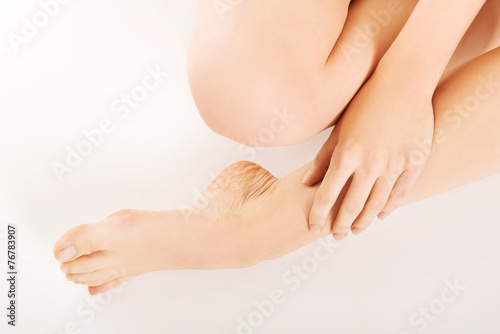 Woman touching her leg