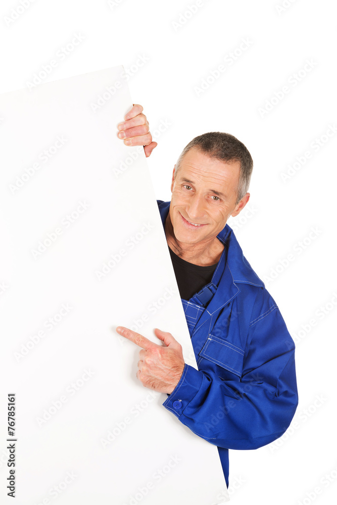 Happy worker presenting empty banner Happy worker presenting empty banner