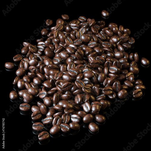Roasted coffee beans on black background for advertising