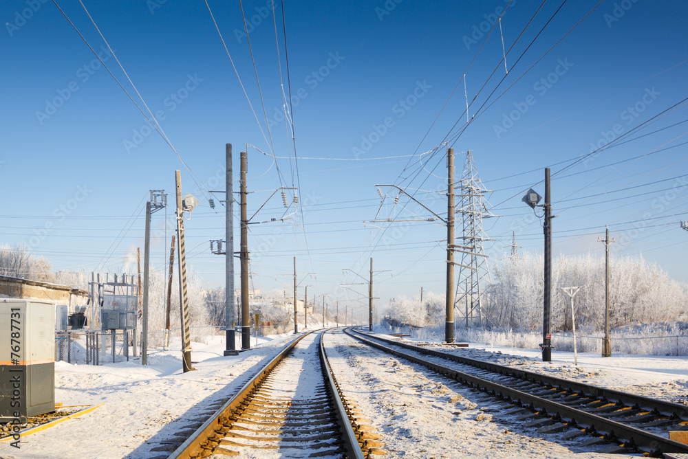 Railroad tracks to winter fog
