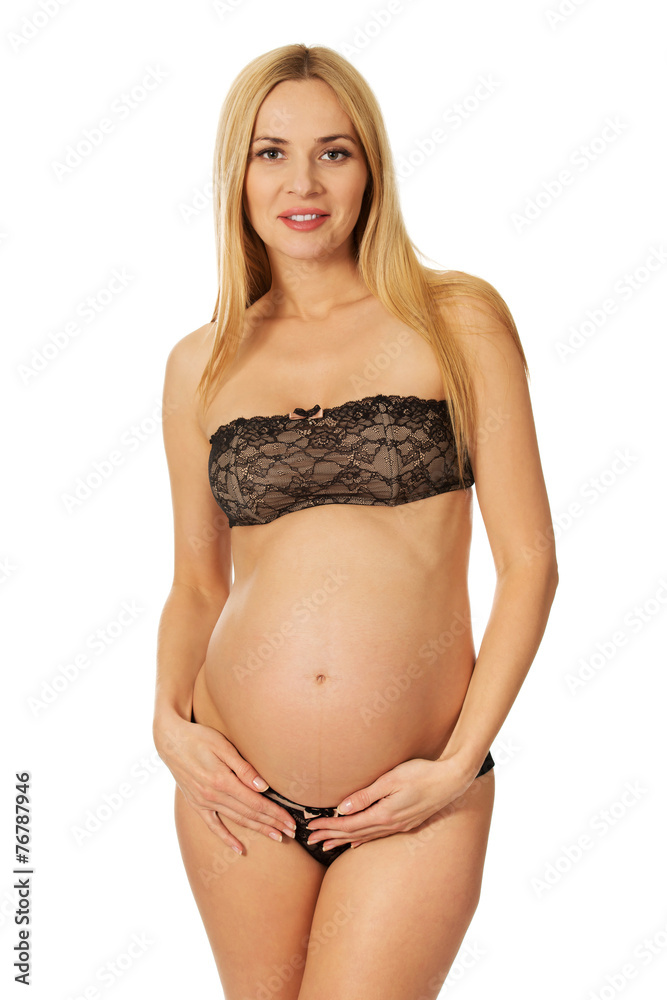 Smiling pregnant woman in lingerie Smiling pregnant woman in lingerie