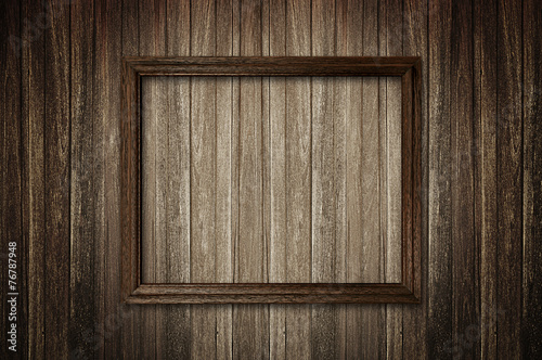 Fototapeta Naklejka Na Ścianę i Meble -  Picture frame on dark wooden wall