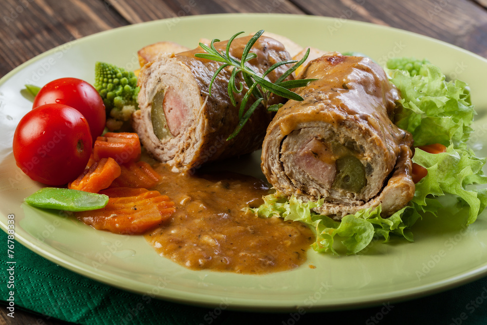 Pork rolls with prepared potatoes and vegetables Pork rolls with prepared potatoes and vegetables