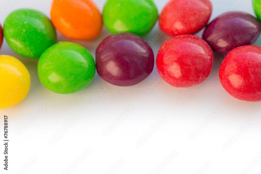 Colorful chewy dragee on a white paper. Colorful chewy dragee on a white paper.