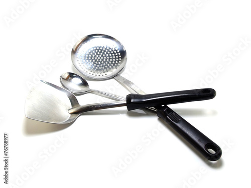 stainless steel kitchen tools on white background