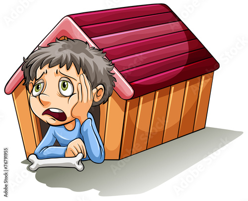 A boy inside the doghouse