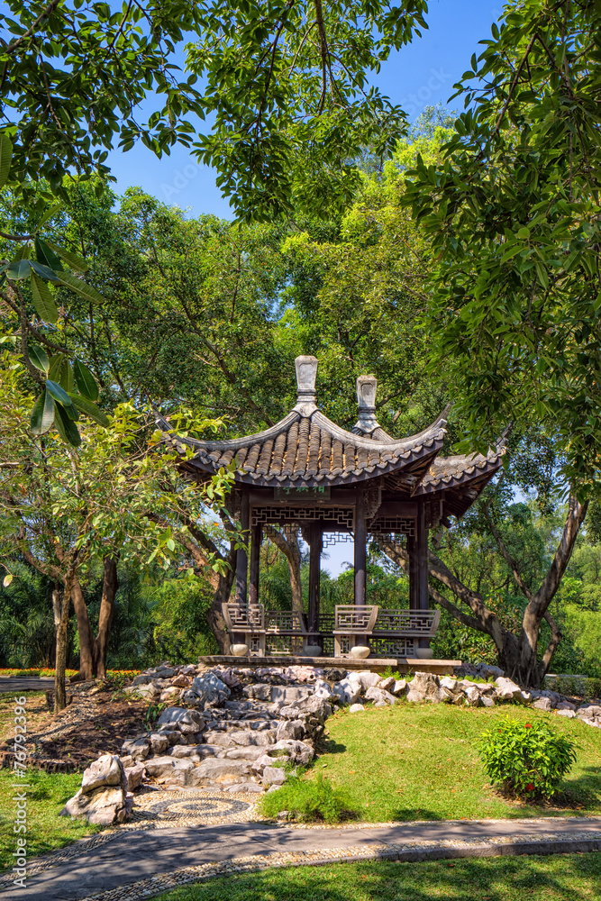 Chinese classical garden with pavilions and pond