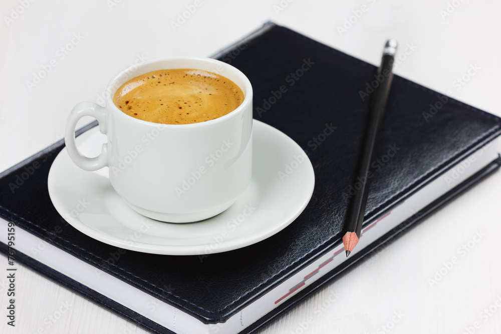 workplace with business diary, pencil and cup of coffee. workplace with business diary, pencil and cup of coffee.