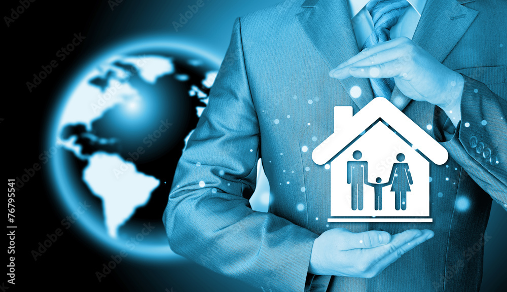 businessman protecting family in home with hands businessman protecting family in home with hands