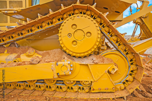 very close up view the track of bbulldozer on sand
