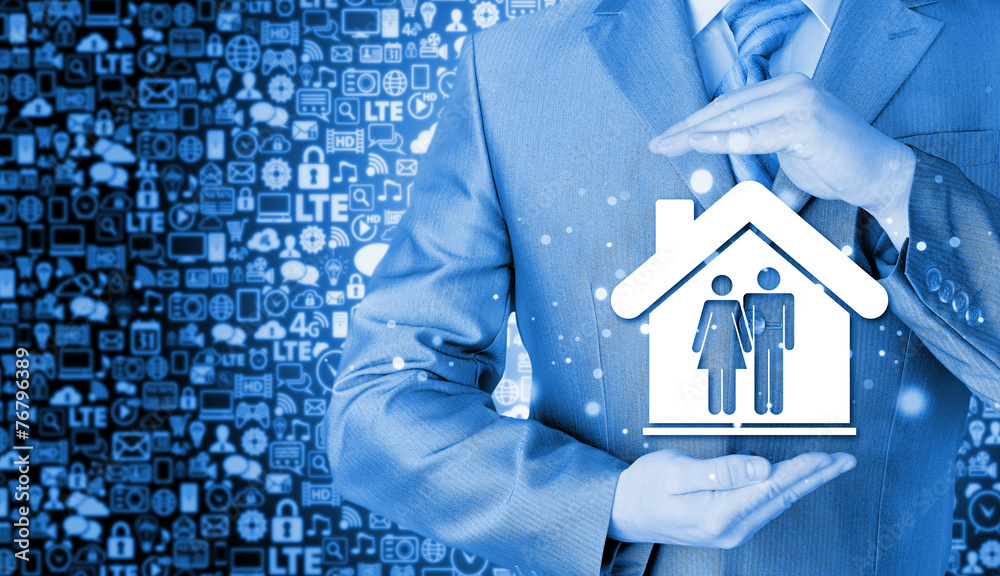 businessman protecting family in home with hands businessman protecting family in home with hands