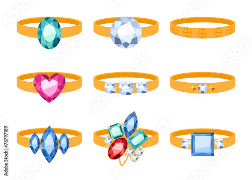 Set of beautyful golden rings with gemstones.