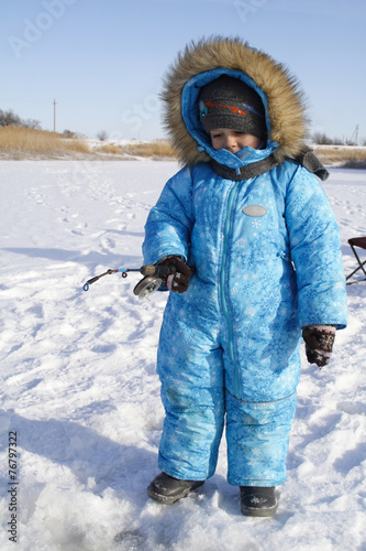 Winter fishing Young fisherman