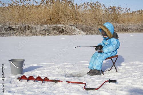 Winter fishing Young fisherman