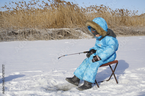 Winter fishing Young fisherman