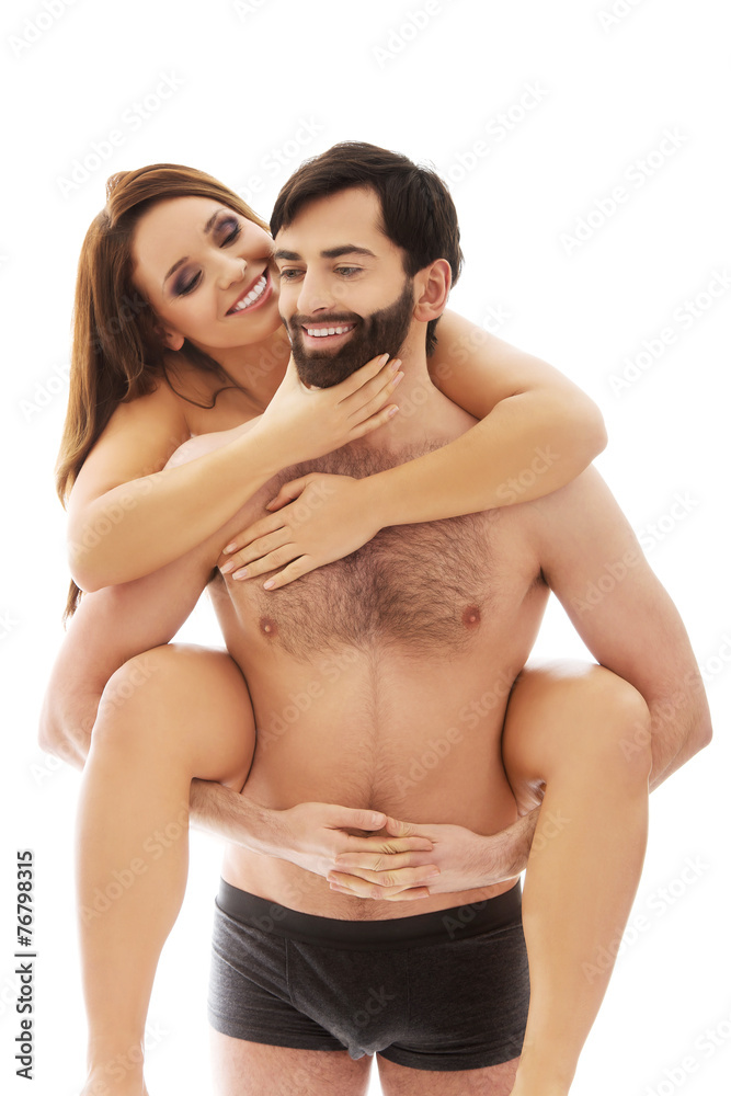 Man carrying girlfriend on his back. Man carrying girlfriend on his back.
