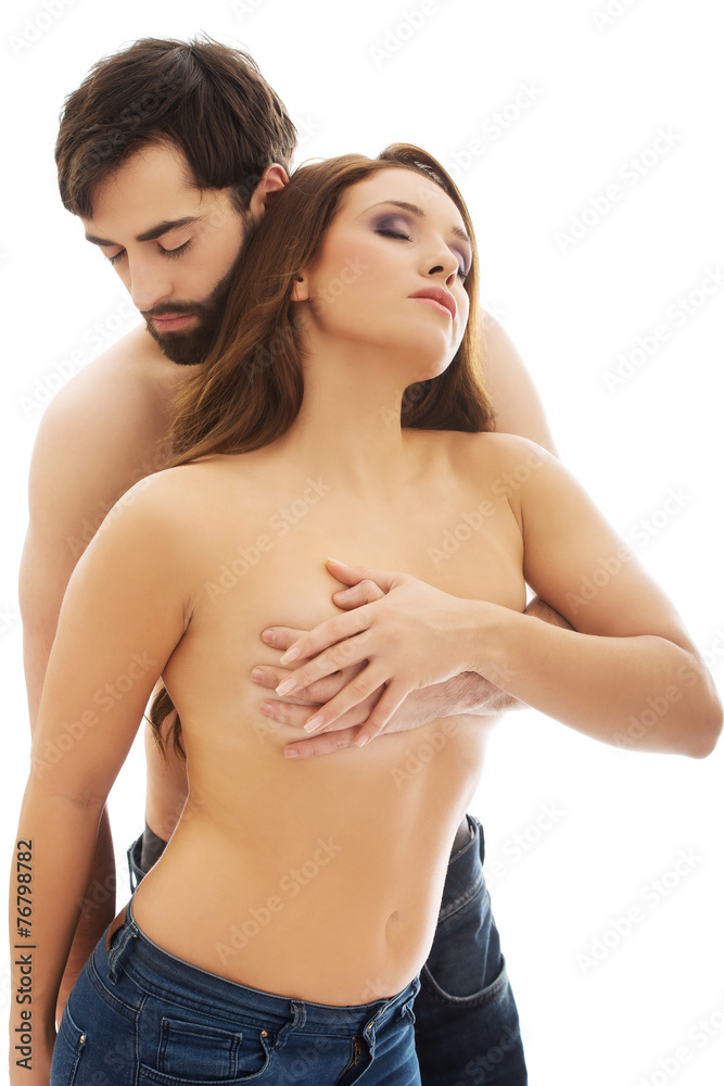 Man covering woman's breast. Stock Photo