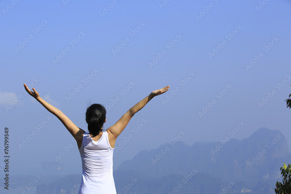 strong confident woman hiker open arms at on mountain peak strong confident woman hiker open arms at on mountain peak
