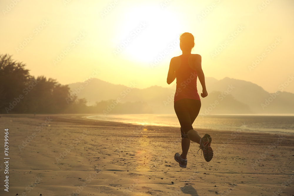 young woman running on sunrise beach young woman running on sunrise beach