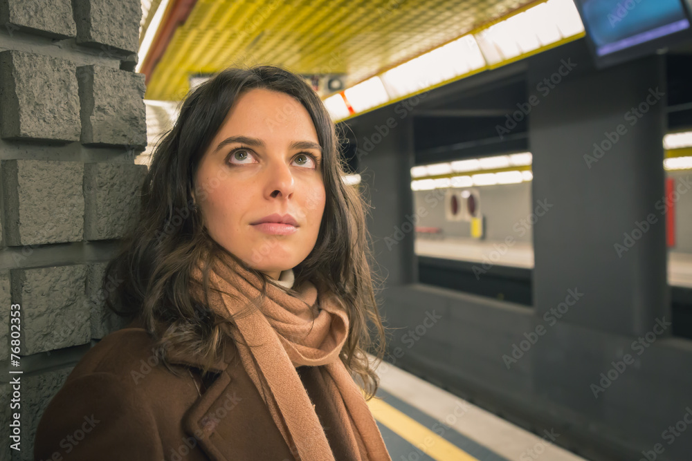 Beautiful young woman posing in a metro station Beautiful young woman posing in a metro station