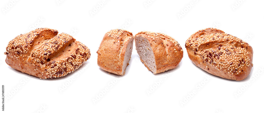 Fresh whole grain bread cut in half on white background