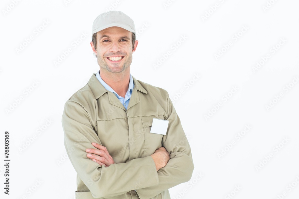 Confident delivery man standing arms crossed Confident delivery man standing arms crossed