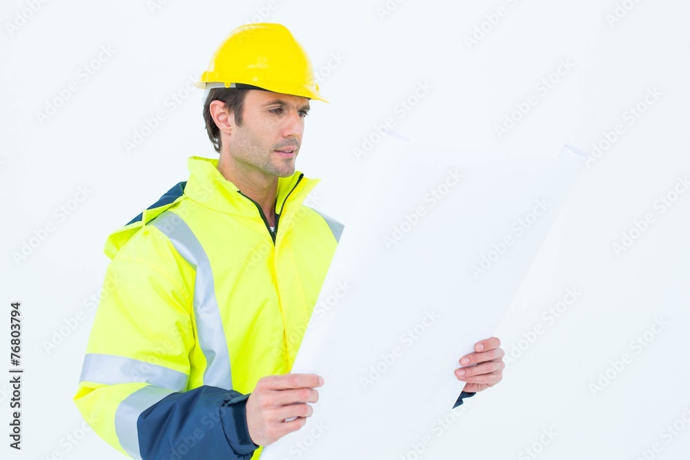 Architect analyzing blueprint over white background Architect analyzing blueprint over white background