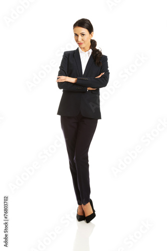 Businesswoman standing with folded arms