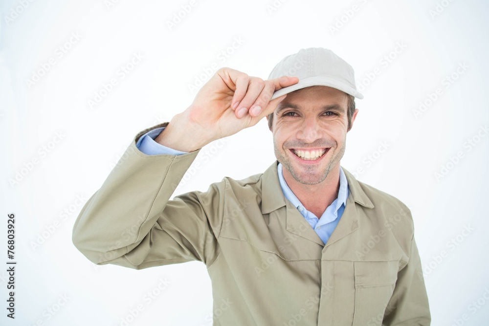 Portrait of happy delivery man holding cap Portrait of happy delivery man holding cap