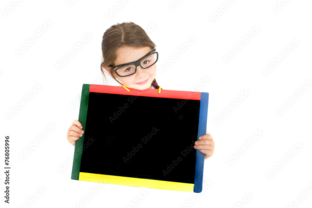 Smiling school child holding a chalkboard Smiling school child holding a chalkboard