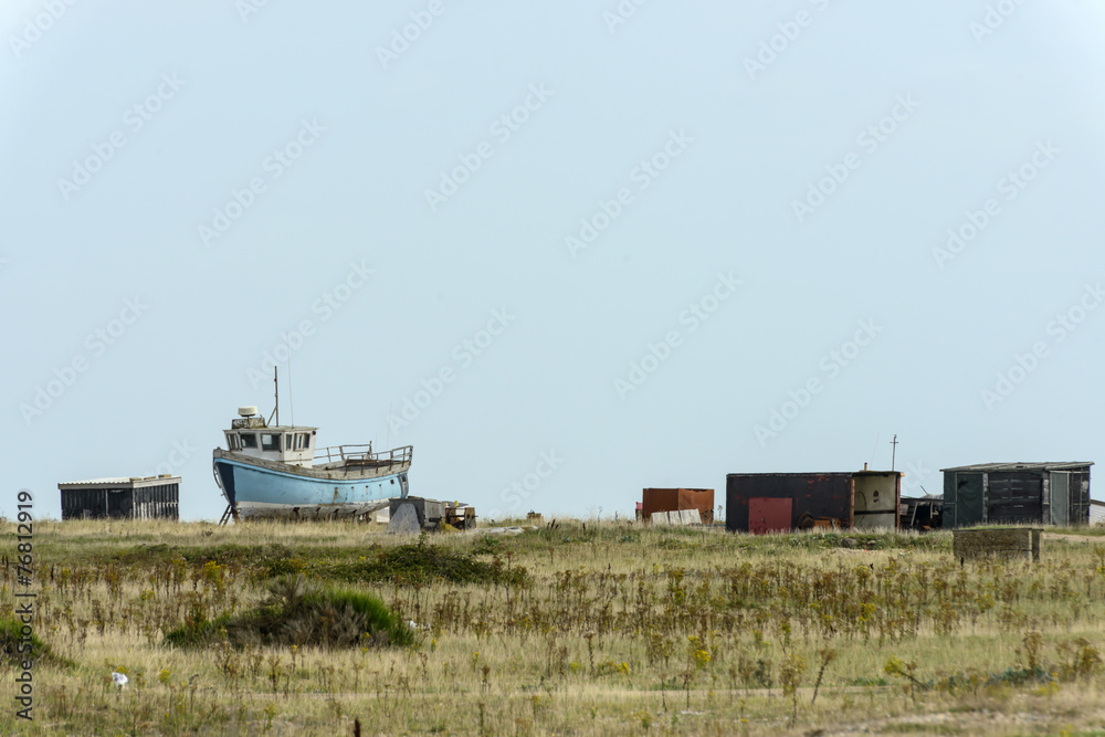 Naklejka premium fish boat aground and sheds at Dungedness