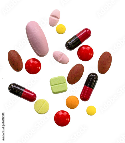 Many color pills  on white background