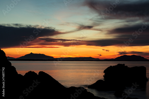 Rock silhouettes and vivid sunset