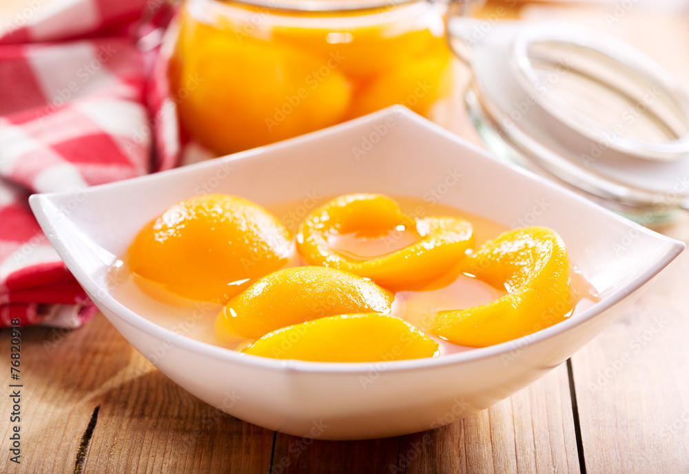 canned peaches in a bowl