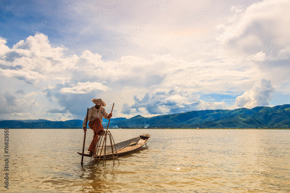 Myanmar fisherman at Inle lake catching fish by traditional tool