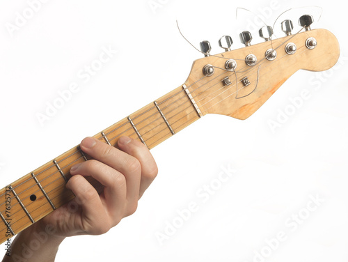 hand playing electronic guitar, isolated on white background photo